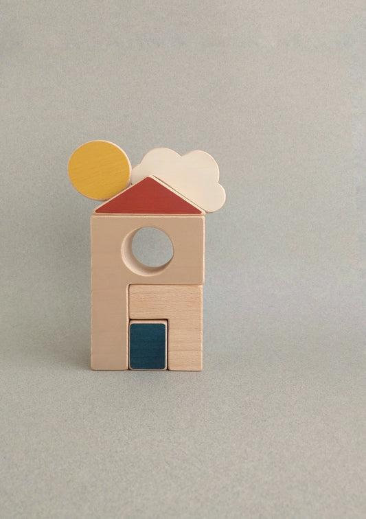 A fun toy with a house and a warm sun over it to stimulate curious little minds and practice motor skills.