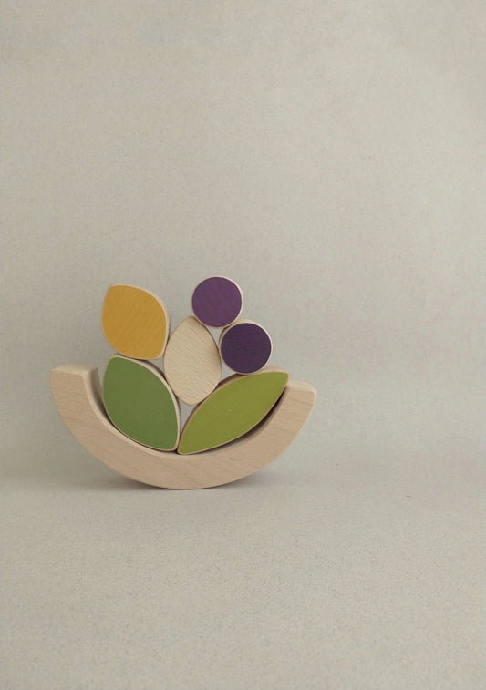 The leaves and blueberries stacking and balance toy is an open-ended, fun wooden toy for the little ones to play with.