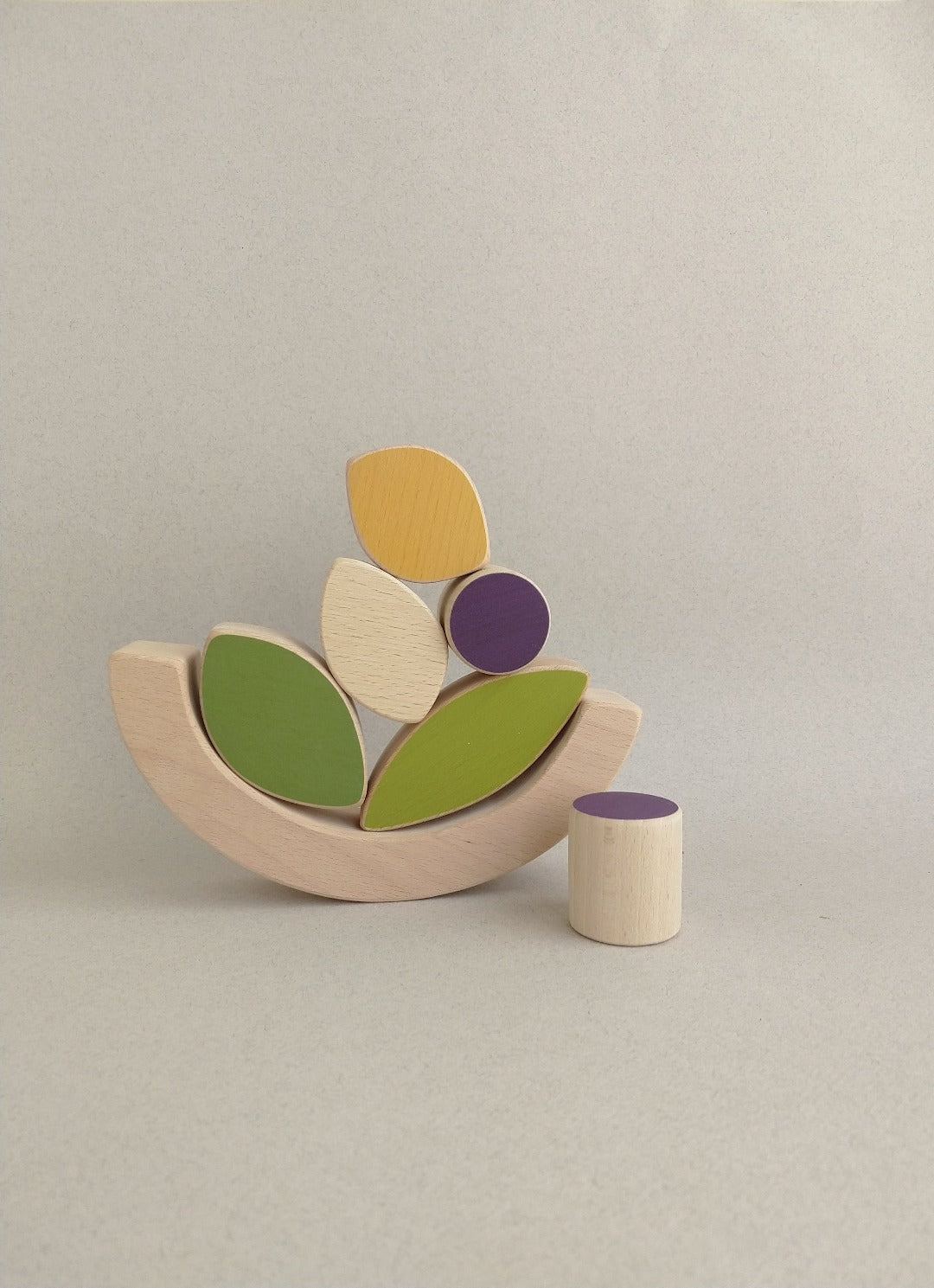 A wooden stacking toy hand-cut, hand-painted and sanded satin smooth.