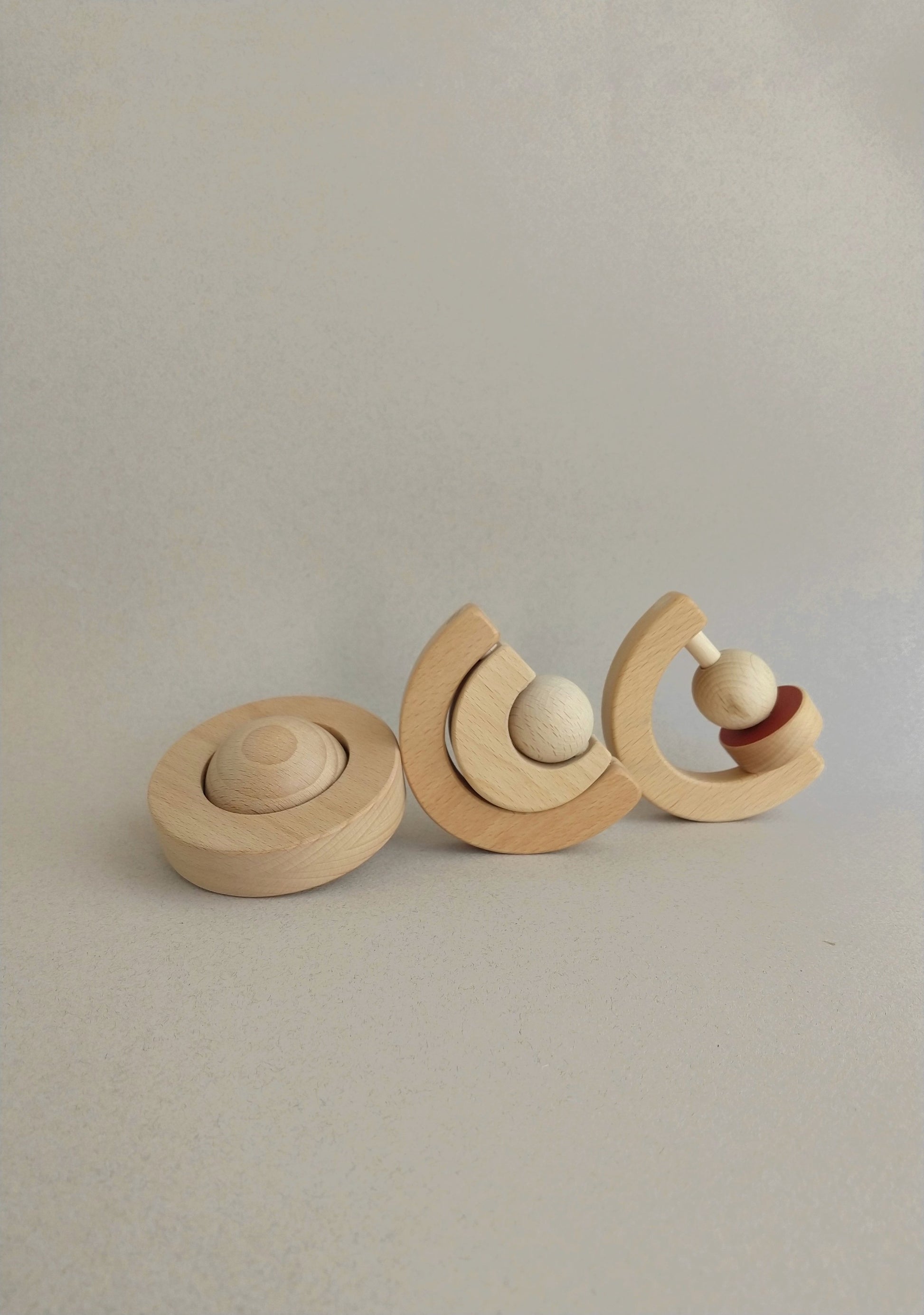 wooden baby teethers hand-cut, hand-painted and sanded satin smooth to offer soft surfaces for little hands.