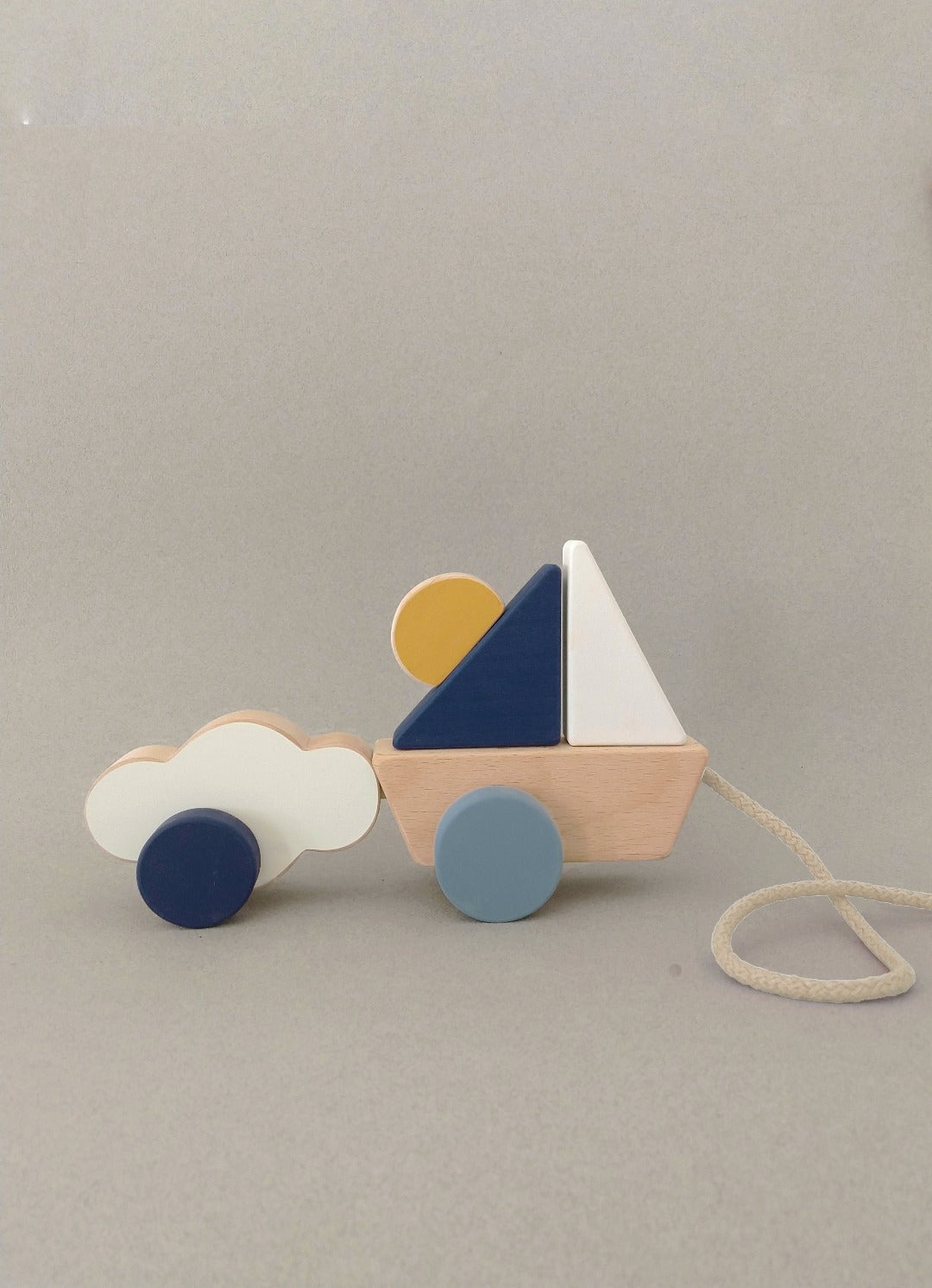 A well-traveled wooden toy boat for little dreamers and imaginative play.