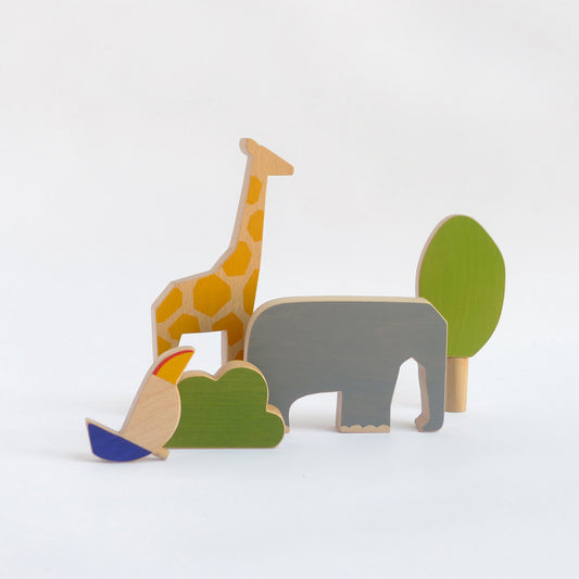 wooden toy animals. Elephant, giraffe, toucan.